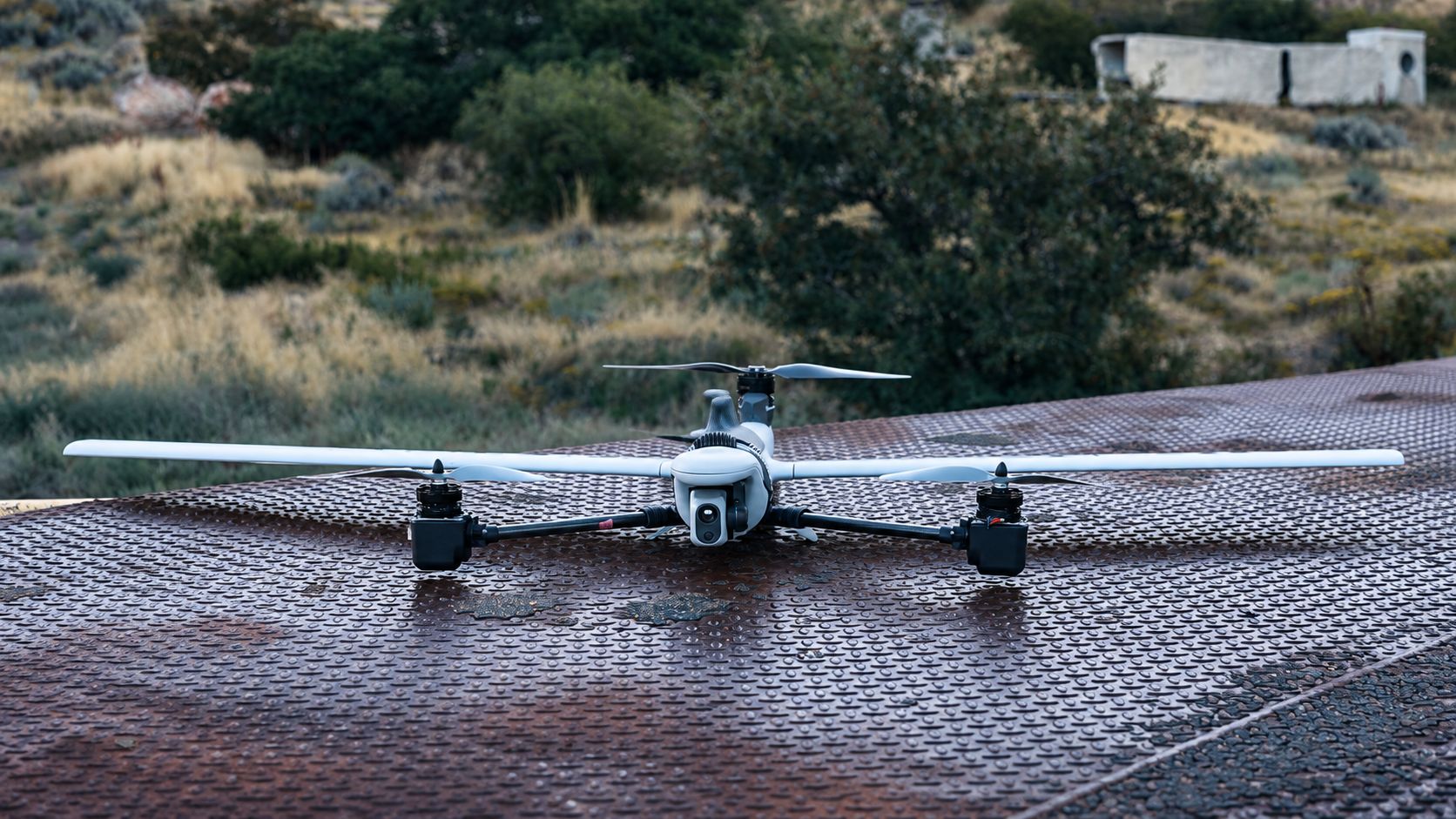 Fixed-wing VTOL aircraft on a steel launch pad