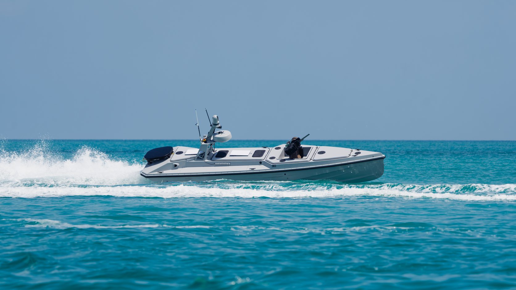 Blue Ops Variant 7 running at speed through turquoise water