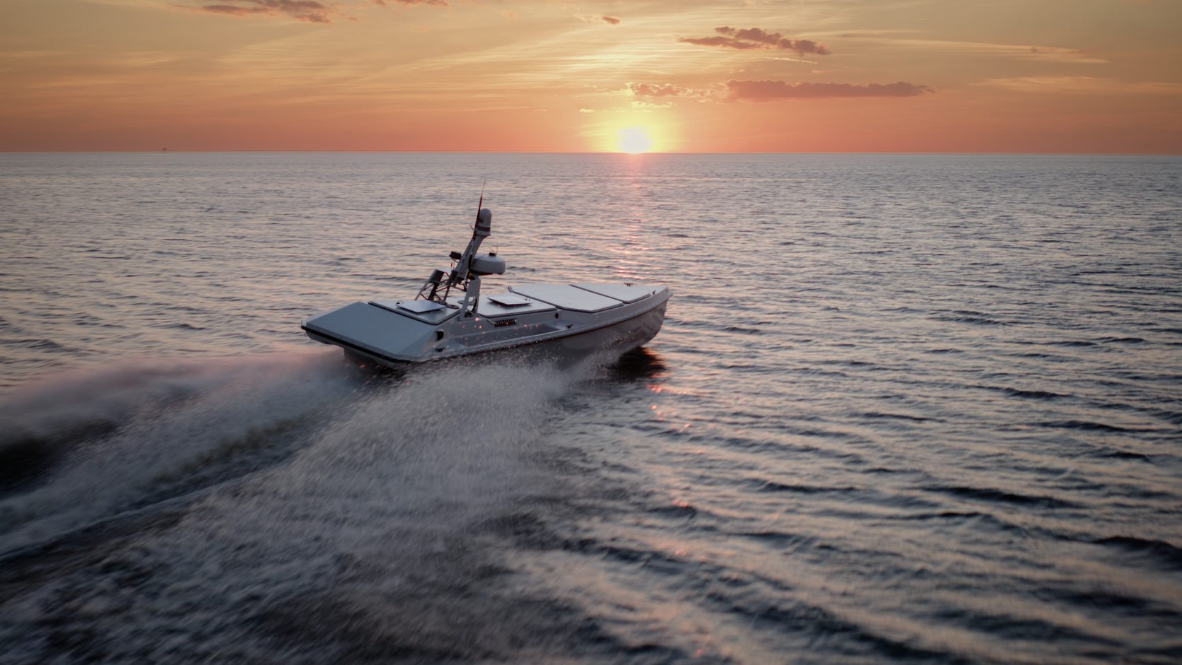 Blue Ops Variant 7 uncrewed surface vessel under way at sunset